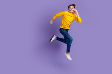 Photo of handsome guy jumping high talking telephone rushing wear casual shirt isolated shine background