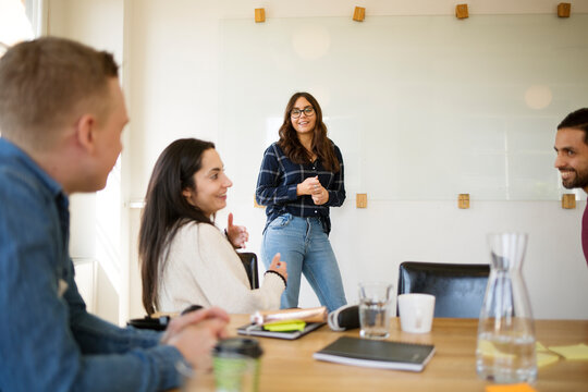 Woman giving presentation in conference room
