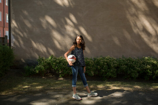 Portrait of girl holding ball