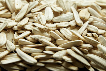 Obraz premium White sunflower seeds. Salted roasted sunflower seeds with white shell
