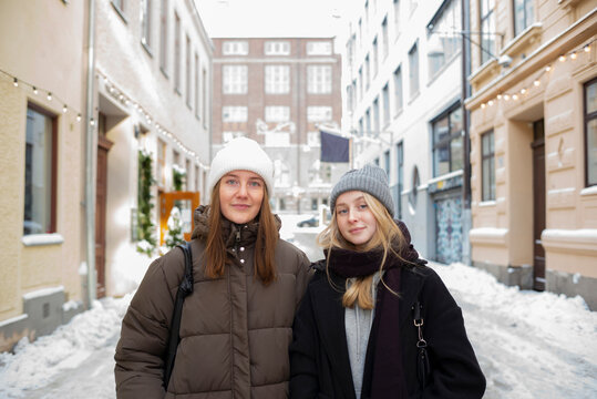 Women on city street in winter