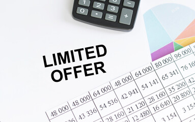 LIMITED OFFER text on a notebook among the documents on the table, a business concept