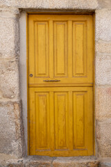 old door in a medieval house in the village of Allariz, Galicia. Spain. Antique