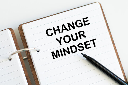 Change Your Mindset text on notepad, concept background