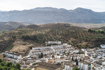 Fototapeta na wymiar the city of Antequera. tight buildings, white houses, monuments, churches view from the castle hill. Peña de los Enamorados hills and rock in the background