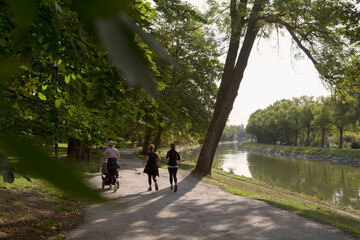 Women jogging on path through park