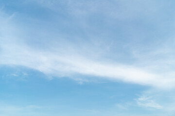 Fototapeta premium Beautiful blue sky bright midday sun with fluffy clouds. Summer sunshine with white cloudscape background. Natural scenic sunny day horizon sky wallpaper backdrop.