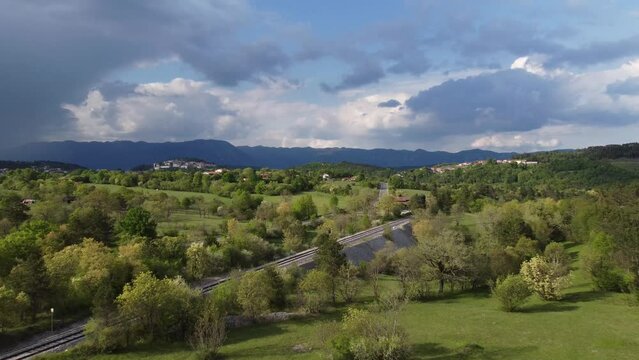 nature camera fly over railway and local road in spring