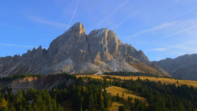 Drone footage of nature, grass fields, forest, mountains in the Italian Dolomites. Filmed with a drone in 4k