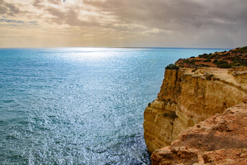 Fototapeta na wymiar Impressive cliffs at the Benagil Caves site in southern Portugal