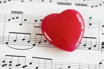 Red heart with musical notes closeup.
