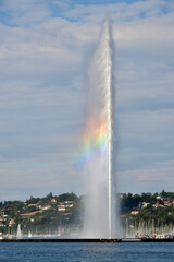 Switzerland, Geneva. A rainbow over the Jet d'Eau (Water-Jet) on Lake Geneva. August 15, 2022.