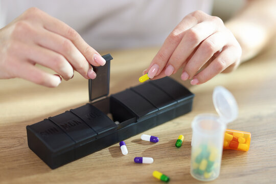 Woman Sorting Drug Pills For Pain Relief And Disease Treatment.