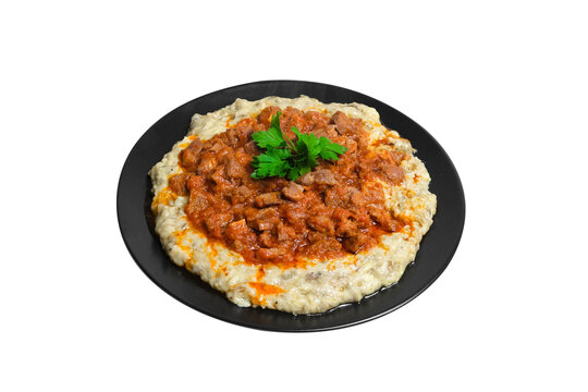 Sultans Delight from Ottoman Cuisine. Lamb Stew Served on a Bed of Aubergine Puree . Turkish Food Hunkar Begendi isolated white background