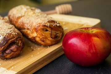 Homemade puff pastry roll with apple and walnuts. Puff pastry apple pastry for dessert