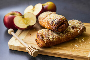 Homemade puff pastry roll with apple and walnuts. Puff pastry apple pastry for dessert