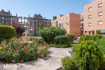 Fototapeta na wymiar Views of buildings and common areas landscaped with flowers of an urban residential housing estate