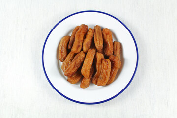Solar dried bananas. sun dried banana. healthy vegan vegetarian food snack concept.