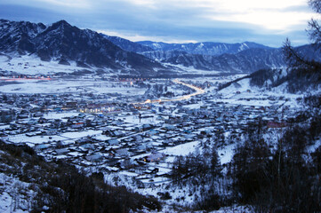 Type on mountains and village with heights