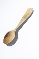 Wooden spoon on white background