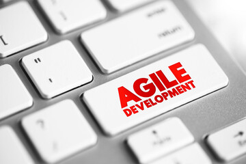 Agile Development - any development process that is aligned with the concepts of the agile manifesto, text concept button on keyboard