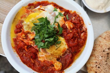 Israeli food - shakshuka poached eggs