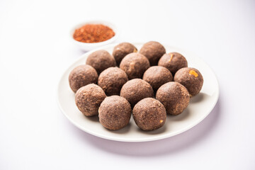 Nachni laddu or Ragi laddoo or sweet balls made using finger millet, jaggery and ghee