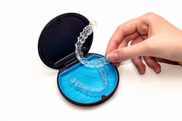 Transparent aligners and storage case. Invisible braces. Clear teeth straighteners. Plastic bracers
