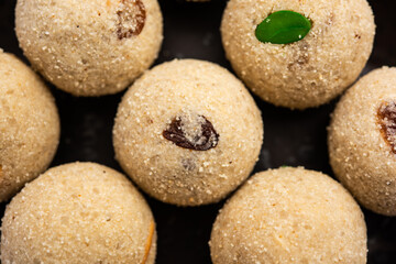 Rava Laddu or sooji ladoo is an Indian Sweet made with semolina, sugar, ghee, cashews and raisins