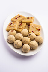 Rava barfi with laddu also called sooji burfi and Laddoo. Indian Sweet made with semolina