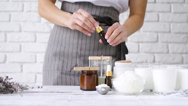woman making handmade candles, preparing the workspace