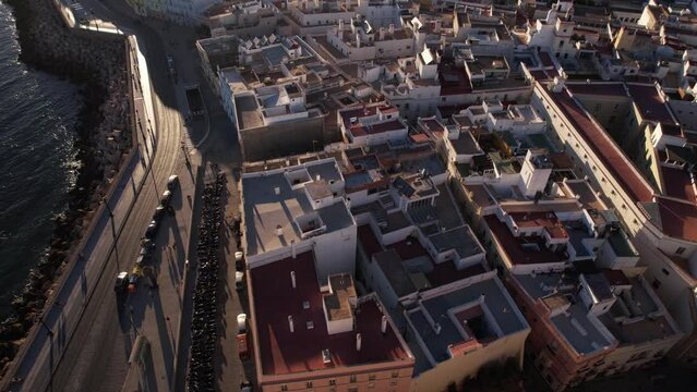 Cadiz, Spain, Revealing Aerial View of Cityscape, Downtown Buildings and Atlantic Ocean on Sunny Evening