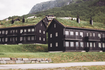 Norway, traditional houses in the mountains with grass on the roof.