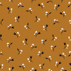 Cute floral pattern. Seamless vector texture. An elegant template for fashionable prints. Print with small white flowers , black leaves. brown background.