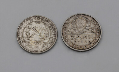 Silver soviet ruble coins on grey background