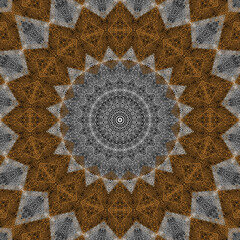 Seamless textured kaleidoscopic pattern. Mandala. Gray, brown background.