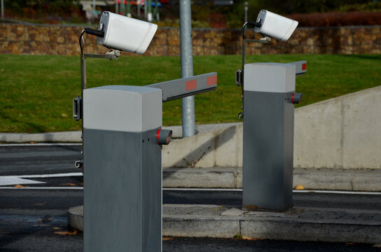 camera system makes it possible to recognize vehicle license plates with high accuracy in real time. The vehicle will arrive at barrier and it will roll up if vehicle's number plate has paid fee