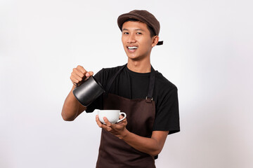 Handsome barista asian man wearing brown apron and black t-shirt isolated over white background ....