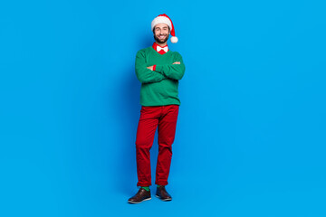 Full length photo of positive attractive man dressed holiday trendy bright clothes new year theme party isolated on blue color background