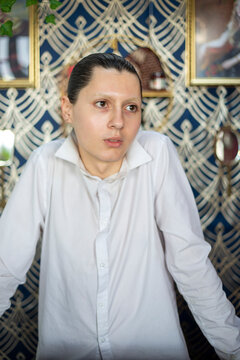 Portrait Of Person With Slicked Back Hair Wearing Shirt�