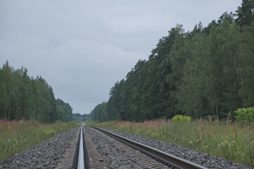 close up of railroad rails, granite and concrete rail sleepers