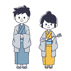 破魔矢を持った着物の女性と男性