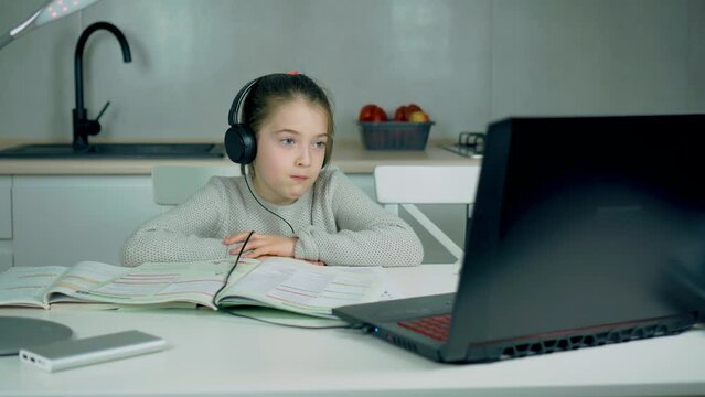 Girl Refugee From Ukraine Have Online Lessons Because Russian Military Invasion. Distance Education Class Concept During Travel Restrictions