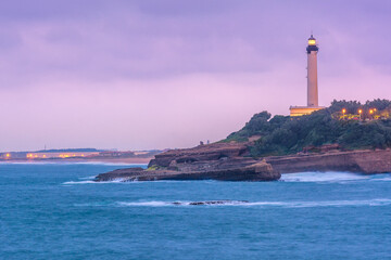 Scenic view of lighthouse against storm clouds in evening at Biarritz, France - obrazy, fototapety, plakaty
