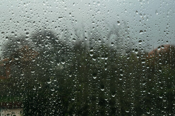 Close-up of raindrops on the window on a rainy day