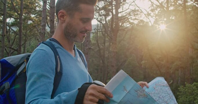Male traveler reading map