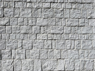 Old chipped white brick wall texture