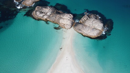 Aerial picture of Wylie bay rocks in Esperance. 2 beaches next to each other. Blue and shallow water. Very beautiful and calm landscape. Walk in the sand between two incredible beaches. Top down drone © Elsa