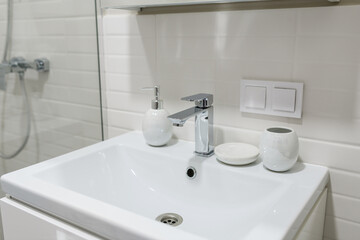 a new white sink in a bright bathroom