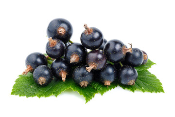 Black currant with green leaves on a white background, organic ripe berries.